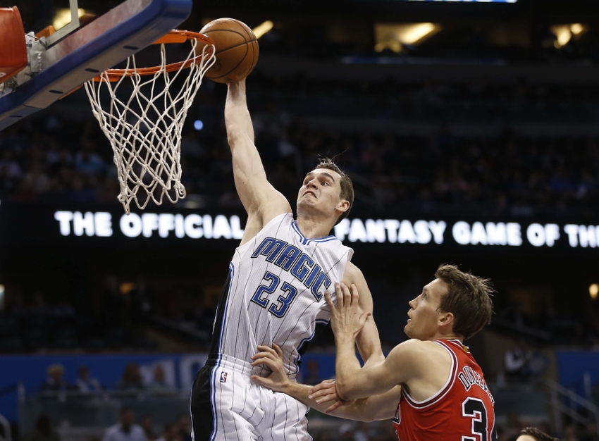 Mar 2, 2016; Orlando, FL, USA; Orlando Magic guard Mario Hezonja (23) dunks the ball over Chicago Bulls guard Mike Dunleavy (34) during the second half of a basketball game at Amway Center. The Magic won 102-89. Mandatory Credit: Reinhold Matay-USA TODAY Sports
