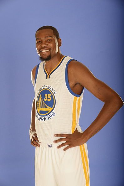 OAKLAND, CA - JULY 7: Kevin Durant #35 of the Golden State Warriors poses for a portrait on July 7, 2016 in Oakland, California. NOTE TO USER: User expressly acknowledges and agrees that, by downloading and or using this photograph, user is consenting to the terms and conditions of Getty Images License Agreement. Mandatory Copyright Notice: Copyright 2016 NBAE (Photo by Noah Graham/NBAE via Getty Images)